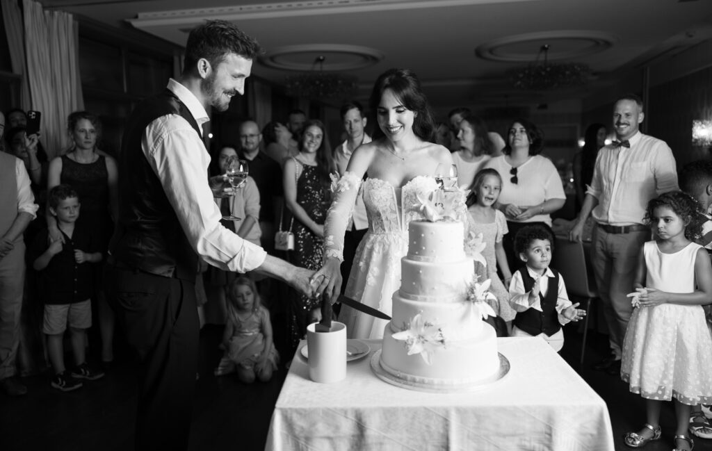 Wedding cake displayed during the reception at Schloss Hünigen in Bern