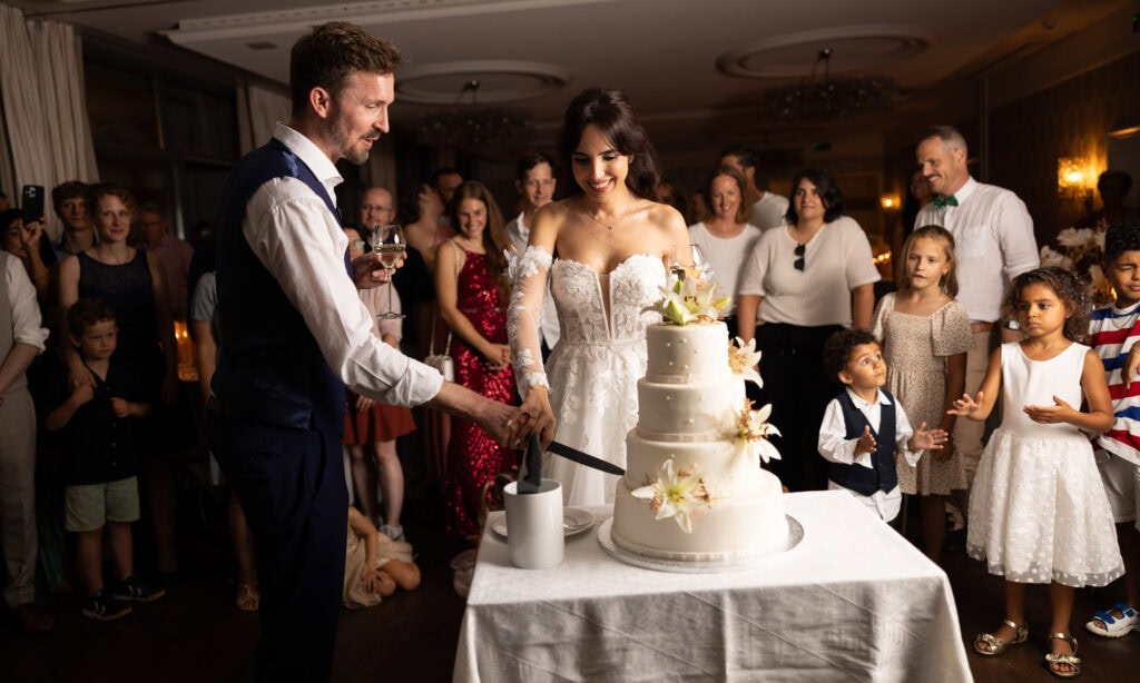 Wedding cake displayed during the reception at Schloss Hünigen in Bern