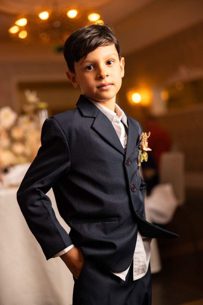 Children sitting at the dinner table during the wedding reception at Schloss Hünigen in Bern