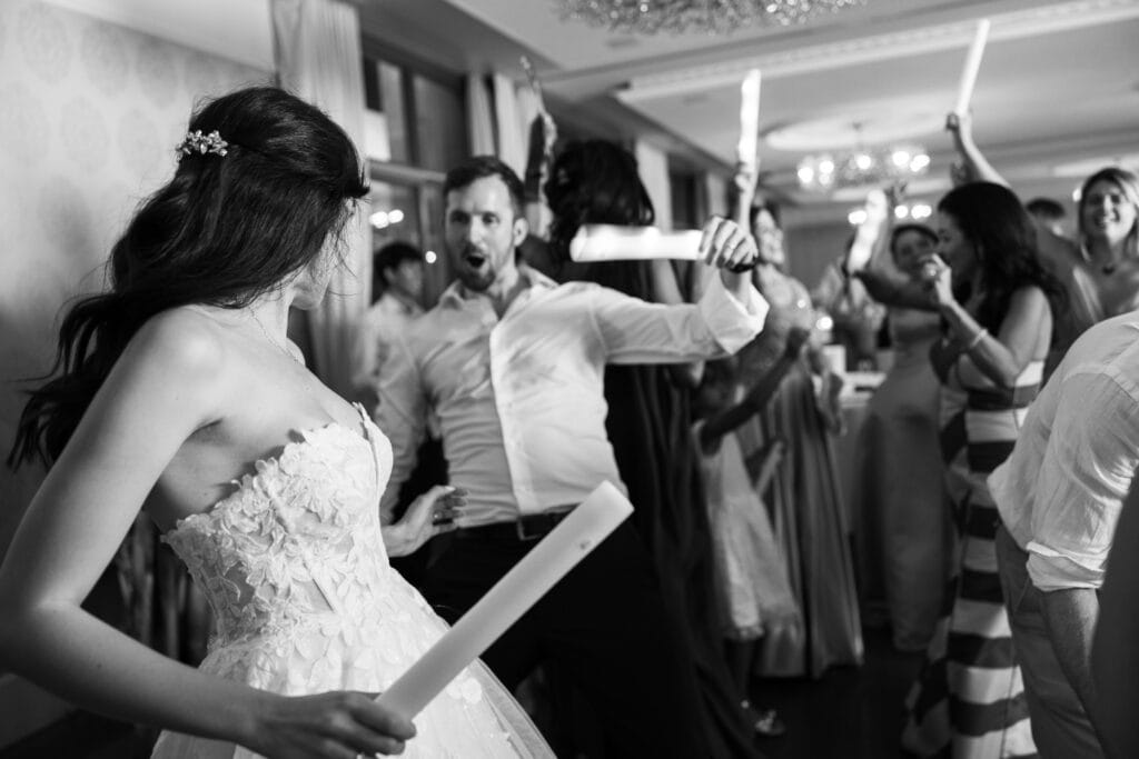 Bride and groom dancing and celebrating during the wedding party at Schloss Hünigen in Bern