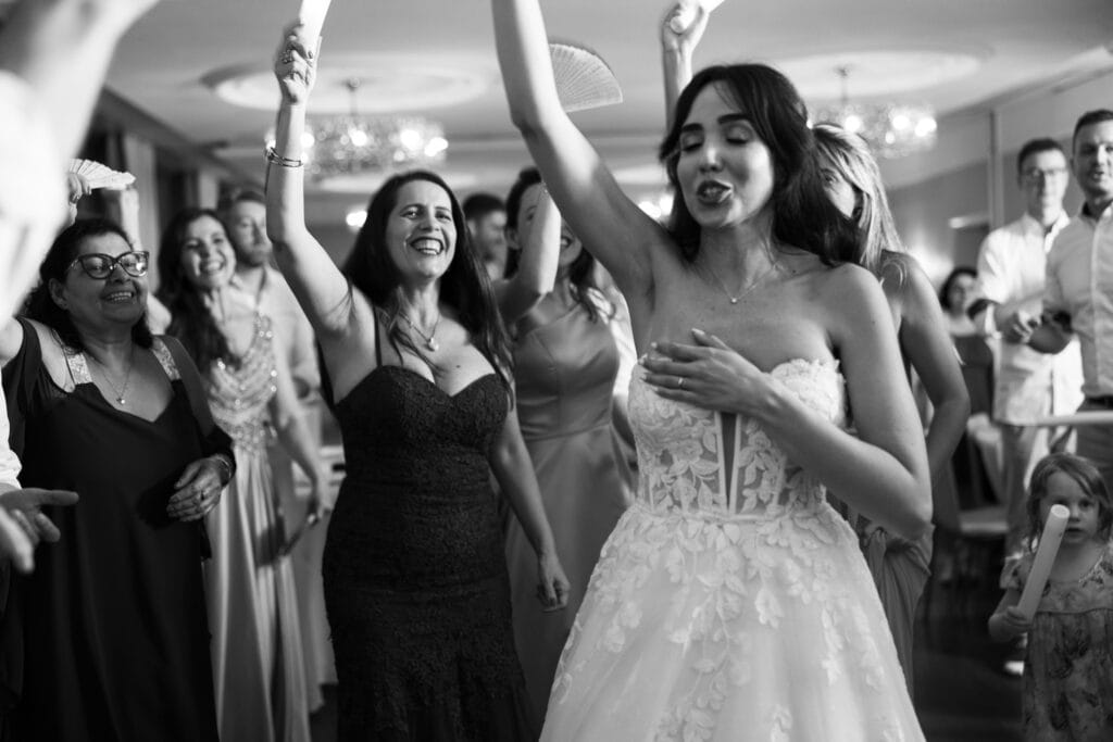 Bride and groom dancing and celebrating during the wedding party at Schloss Hünigen in Bern