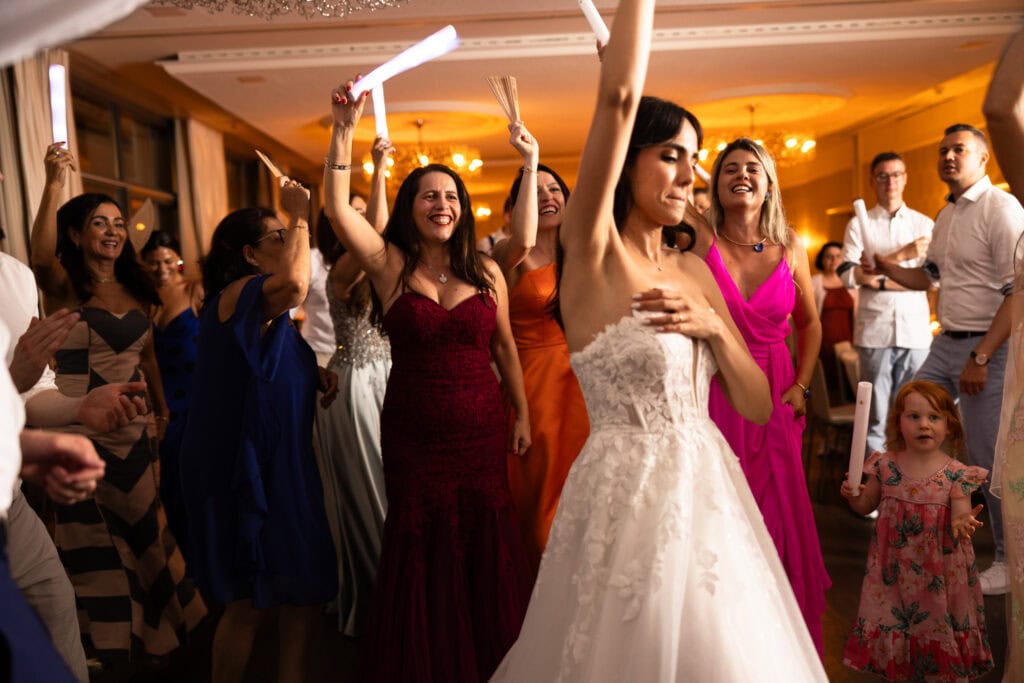 Bride and groom dancing and celebrating during the wedding party at Schloss Hünigen in Bern